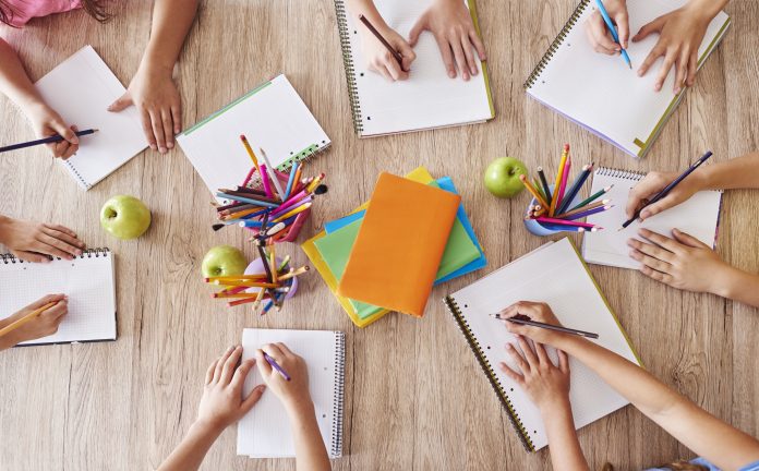 Busy students over one table