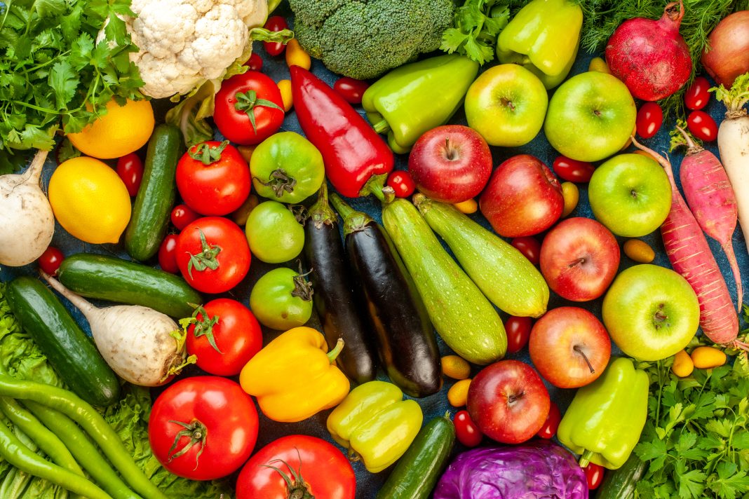 top-view-vegetable-composition-with-fresh-fruits-blue-table