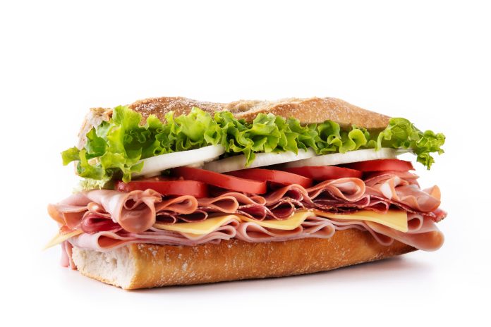 Submarine sandwich with ham, cheese, lettuce, tomatoes,onion, mortadella and sausage