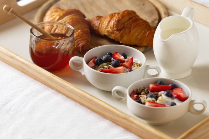 Tasty colorful Breakfast with Oatmeal, Yogurt, Strawberry, Blueb