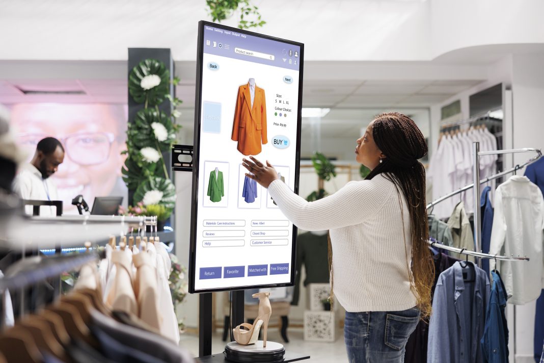 Woman buyer selecting clothes on board